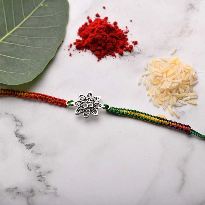 Rakhi with OM designed on Flower